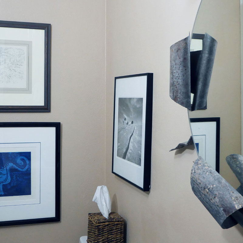 Thumbnail | Several Framed Pieces and A Custom Mirror in A Bathroom